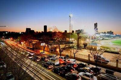 Cars road in city during sunset