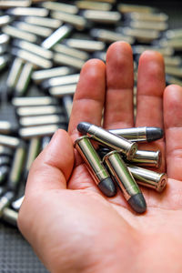 Close-up of human hand holding metal