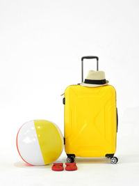 Close-up of yellow toy over white background