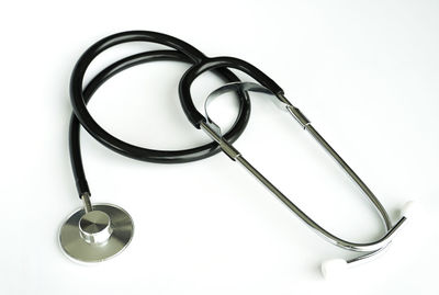 High angle view of eyeglasses on table against white background
