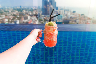 Close-up of hand holding ice cream