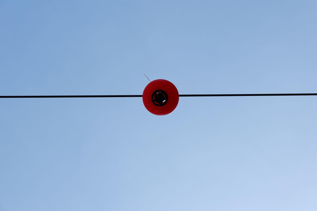 LOW ANGLE VIEW OF LIGHT BULBS AGAINST CLEAR SKY