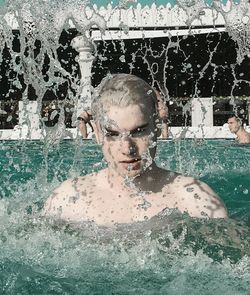 Close-up portrait of man swimming in pool