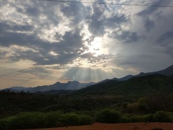 Scenic view of silhouette mountains against sky during sunset