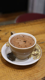 Close-up of coffee cup on table