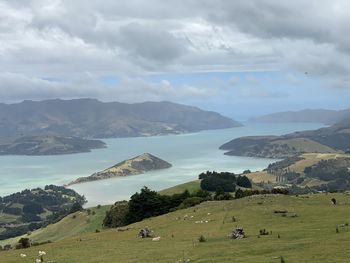 Scenic view of landscape and mountains against sky