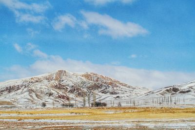 Scenic view of snowcapped mountains against sky