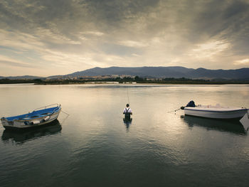 Boats in calm lake