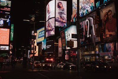 Illuminated city street at night