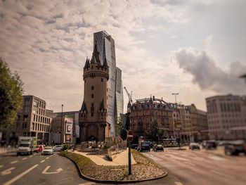 City street against cloudy sky