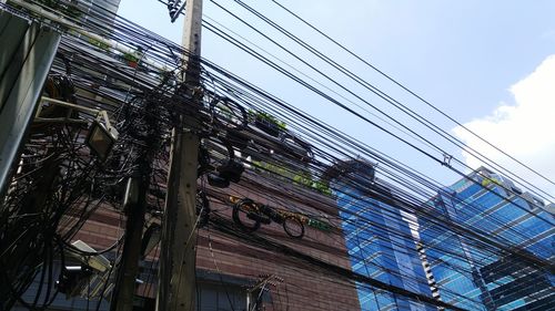 Low angle view of cables against sky