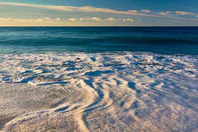 Scenic view of sea against sky during sunrise