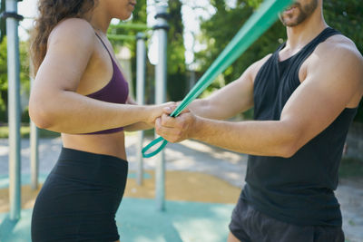 Midsection of woman holding hands