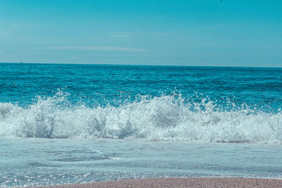 Scenic view of sea against blue sky