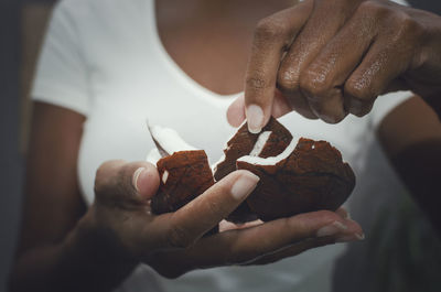 Close-up of hand holding ice cream