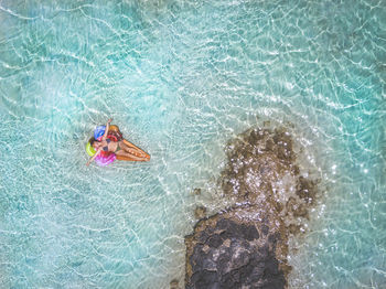 High angle view of woman swimming in pool