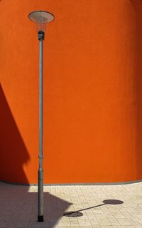 Street light and orange on wall