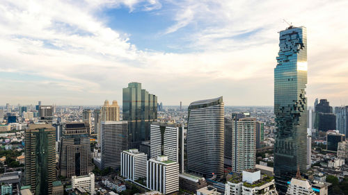 Modern buildings in city against sky