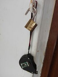 Close-up of padlocks hanging on wall