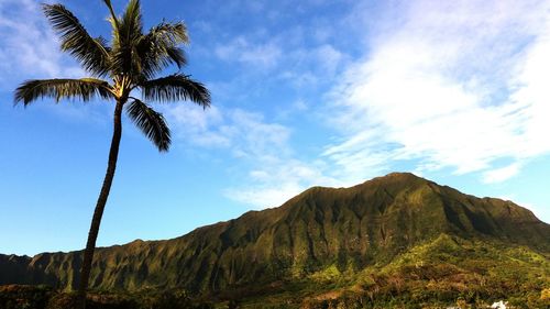 Low angle view of mountain against cloudy sky