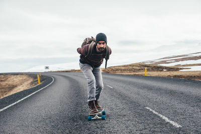 Man skateboarding on highway