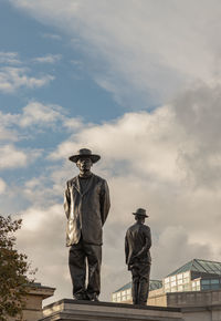 Rear view of man standing against sky