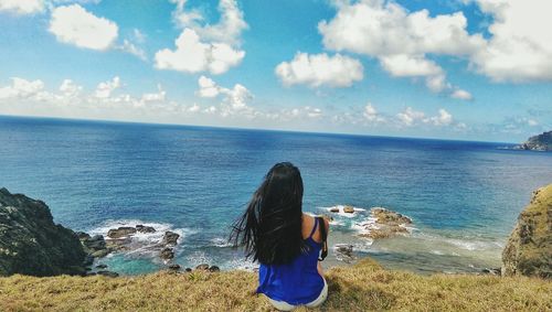 Scenic view of sea against cloudy sky