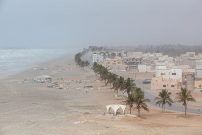 High angle view of beach and buildings against sky