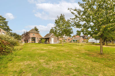 House on field against sky