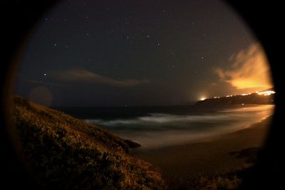 Scenic view of landscape against sky at night