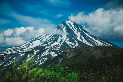 Scenic view of snowcapped mountains against sky
