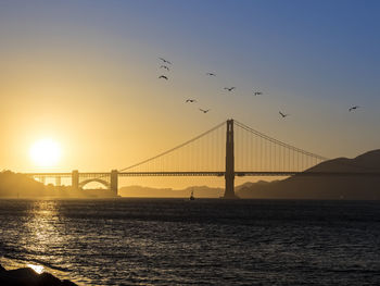 Golden gate bridge against sky during sunset