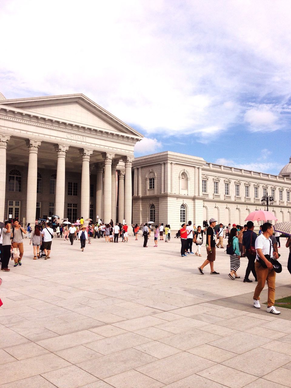 architecture, large group of people, built structure, building exterior, famous place, tourism, travel destinations, history, person, tourist, sky, travel, religion, international landmark, men, place of worship, spirituality, architectural column, facade