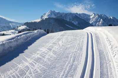 Scenic view of snow covered mountains against sky