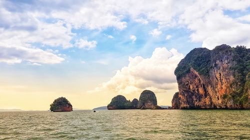 Rocks in sea against sky