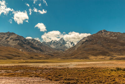 View of mountain range against cloudy sky