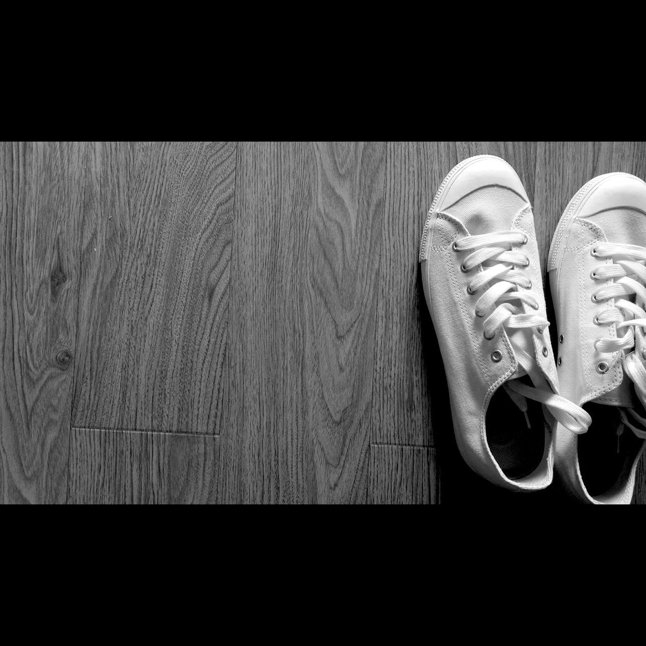 shoe, footwear, low section, pair, person, close-up, indoors, high angle view, copy space, part of, pattern, still life, floor, auto post production filter, canvas shoe, directly above, flooring, textured, sand