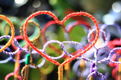 Close-up of multi colored rope tied on tree