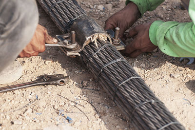 High angle view of people with metal working at construction site