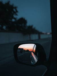 Reflection of car on side-view mirror