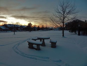 Snow covered landscape against sky