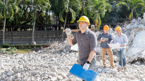 Rear view of man working on field