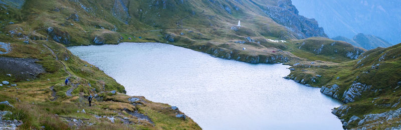 Sunrise on fagaras high mountain ridge. romanian mountain landscape with high peaks over 2200m