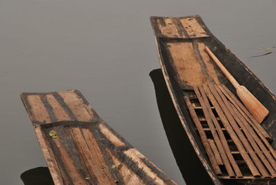 Low angle view of wood against sky