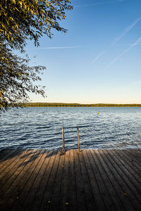 Pier over lake against sky