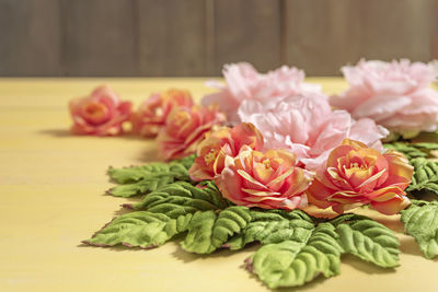 Close-up of pink roses on table