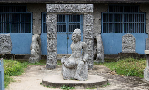 Statue against building