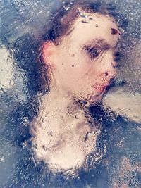 Close-up portrait of wet girl in bathroom