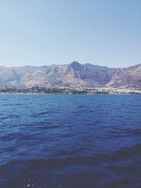 Scenic view of sea against clear blue sky