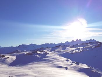 Scenic view of snowcapped mountains against sky